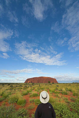 Wall Art - Photograph - Tourist And Clouds At  Ayers Rock by Yva Momatiuk John Eastcott