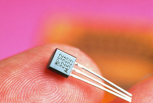 Wall Art - Photograph - Transistor From The 1990s Rests On A Fingertip by Science Photo Library