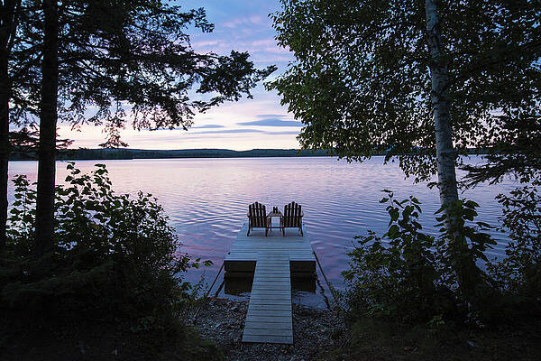 Wall Art - Photograph - Two Empty Adirondack Chairs Sitting by Jake Wyman