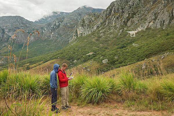 Wall Art - Photograph - Two Men Monitor The Drone by Alexandra Simone