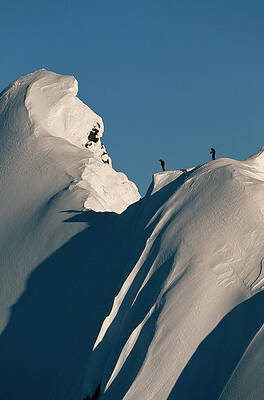 Wall Art - Photograph - Two Skiers On Top Of A Snowy Mountain by Adam Clark