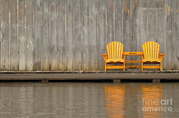 Two wooden chairs on an old dock by Les Palenik Two wooden chairs on an old dock by Les Palenik