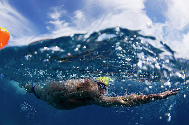 Wall Art - Photograph - Underwater View Of A Swimmer Rounding by Krystle Wright