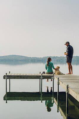 Wall Art - Photograph - Woman, Dog And Man Relaxing On The End by Corey Hendrickson