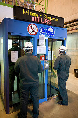 Wall Art - Photograph - Workers At Cern by Science Photo Library