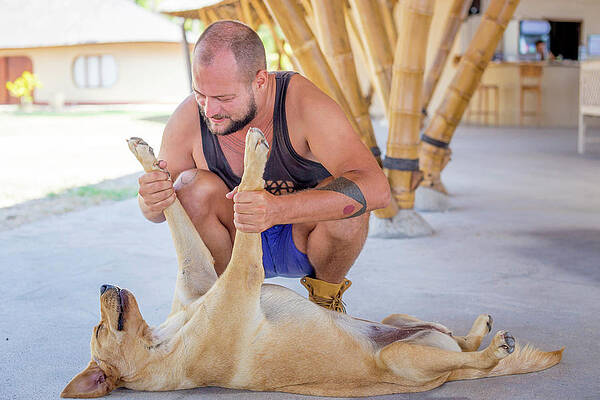 Wall Art - Photograph - Young Man Playing With Dog by Konstantin Trubavin