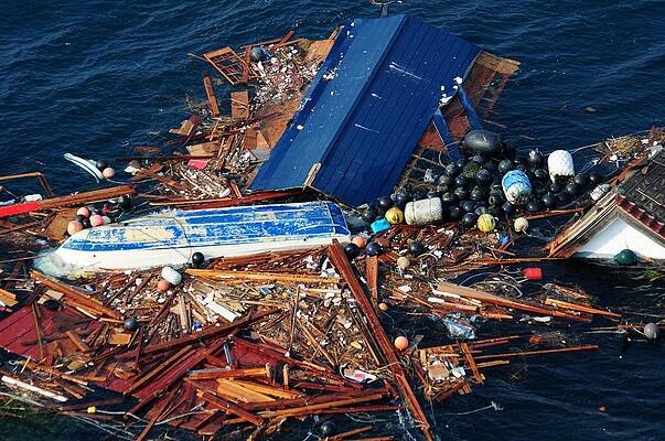 Wall Art - Photograph - An Overturned Tug Boat Floats by Everett