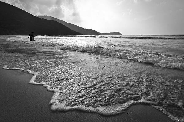 Black and white image of waves rolling onto a beach by Anya Brewley schultheiss Black and white image of waves rolling onto a beach by Anya Brewley schultheiss