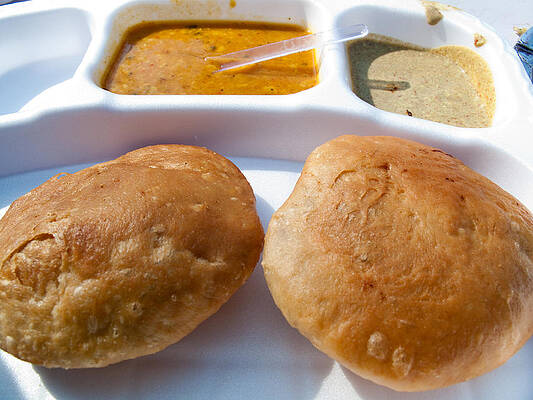 Close up of a plate of Indian food delicacy Kachori with Sabzi and Chutney by Ashish Agarwal Close up of a plate of Indian food delicacy Kachori with Sabzi and Chutney by Ashish Agarwal