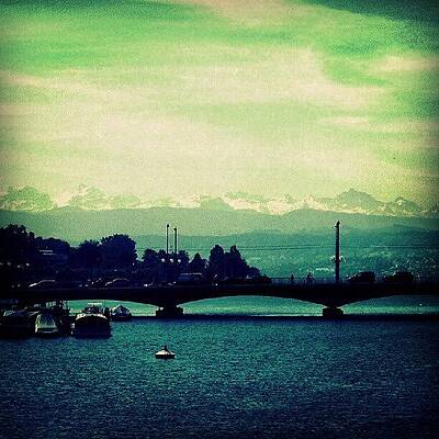 Wall Art - Photograph - Limmat River With Swiss Alps at the background by Sigit Pamungkas