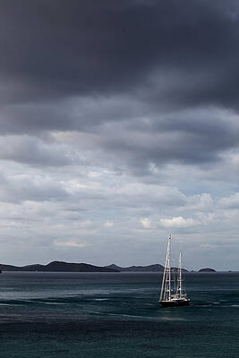 Lone yacht on the sea with dynamic moody clouds by Anya Brewley schultheiss Lone yacht on the sea with dynamic moody clouds by Anya Brewley schultheiss