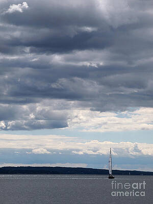 Sailboat under clouds by Gene Marchand Sailboat under clouds by Gene Marchand