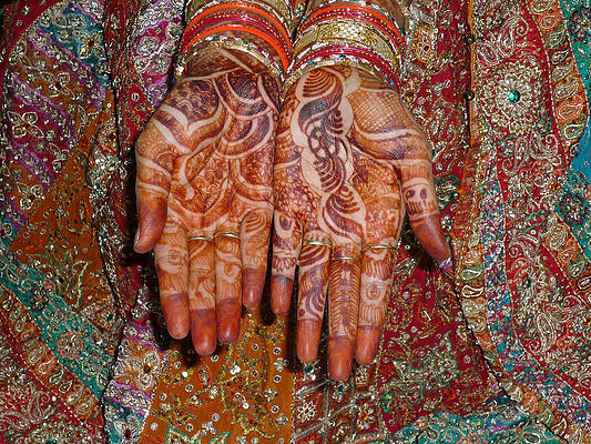 The wonderfully decorated hands and clothes of an Indian bride by Ashish Agarwal The wonderfully decorated hands and clothes of an Indian bride by Ashish Agarwal
