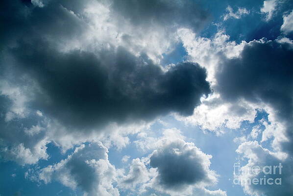 Wall Art - Photograph - Clouds floating across a blue sky #1 by Sami Sarkis Photography