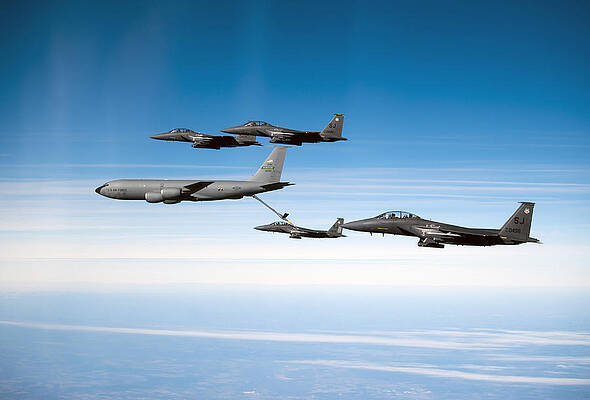 Wall Art - Photograph - A F-15e Strike Eagle Is Refueled by Stocktrek Images