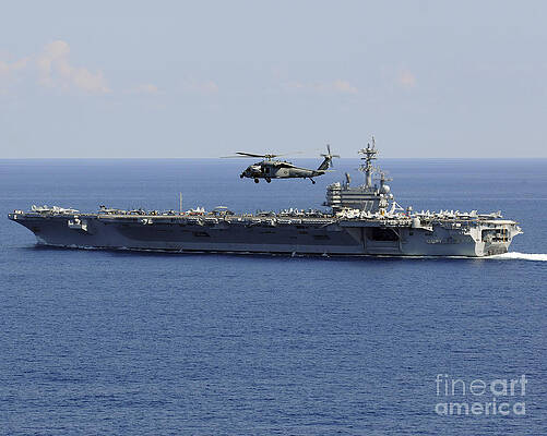 Wall Art - Photograph - An Mh-60s Seahawk Helicopter Flies by Stocktrek Images