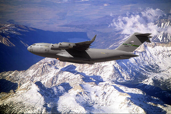 Wall Art - Mixed Media - C-17 Globemaster III Over Snow Capped Mountains by Erik Simonsen