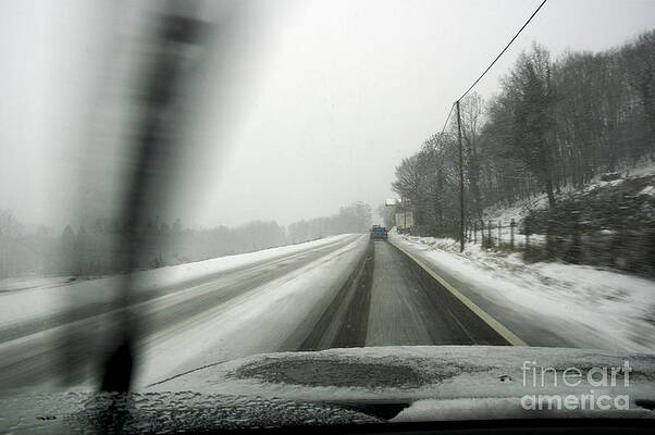 Wall Art - Photograph - Car driving on a snowy road in the winter by Sami Sarkis Photography