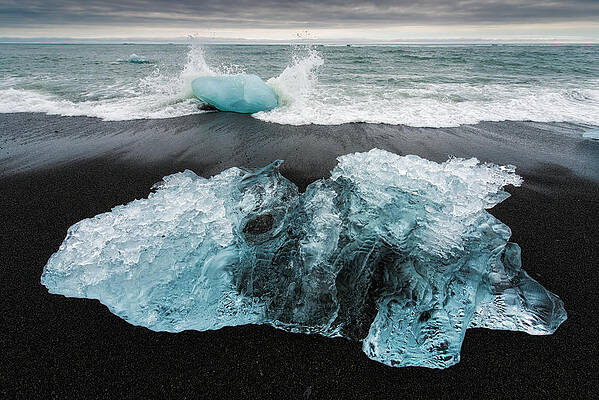 Iceberg and black beach in Iceland by Matthias Hauser Iceberg and black beach in Iceland by Matthias Hauser