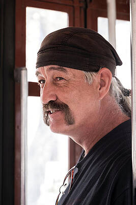 Man on Trolley by Stan Roban