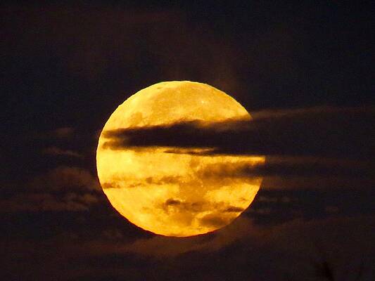 Moon on a cloudy night by Linda Anderson