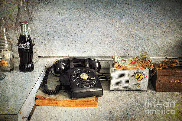Old telephone on yellow background. Vintage phone with taken off receiver  by Michael Dechev