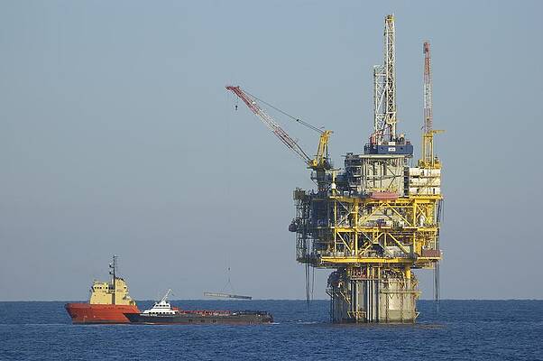 Wall Art - Photograph - Spar type oil platform with supply vessels by Bradford Martin