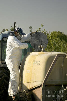 Wall Art - Photograph - Worker Preparing Pesticide Sprayer by Inga Spence