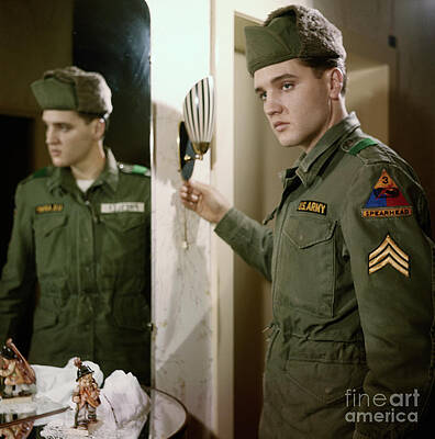 Wall Art - Photograph - Elvis Presley Showing His Army Stripes #1 by Bettmann