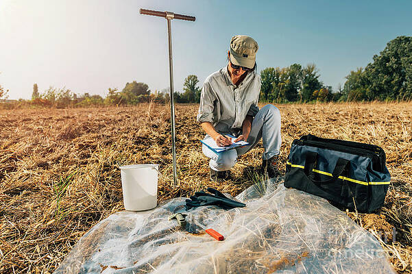 Wall Art - Photograph - Soil Scientist Taking Notes #2 by Science Photo Library
