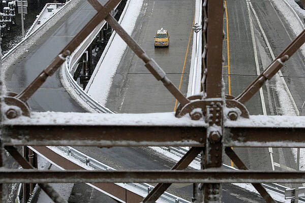 Wall Art - Photograph - A Lone Taxi Drives Down the Franklin D by Andrew Kelly
