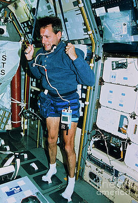 Wall Art - Photograph - Astronaut Exercising Aboard The Shuttle Columbia by Science Photo Library