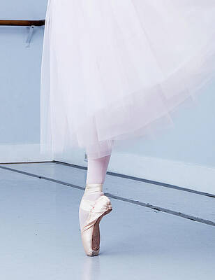 Ballerina On Pointe Low Angle View Print by Jonya