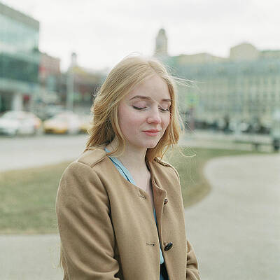 Wall Art - Photograph - Beautiful Blonde Woman Looking Down And Smile by Cavan Images