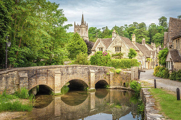 Castle Wall Art featuring the digital art Bridge Across Bybrook River In Castle Combe, Wiltshire, England, Great Britain by Christian Muringer