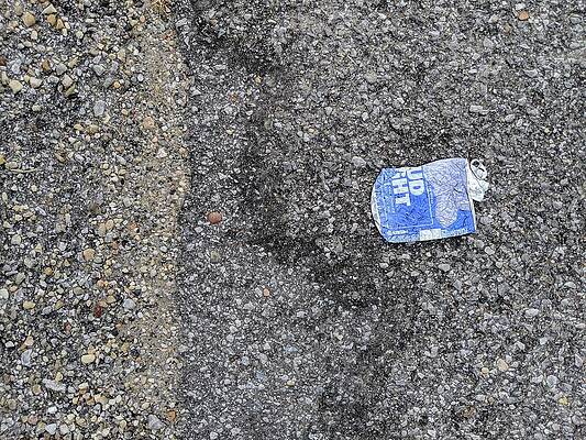 Wall Art - Photograph - #BudLitter and Two Types of Asphalt Aggregate by Jeremy Butler