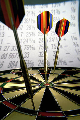 Wall Art - Photograph - Darts On A Dartboard With Stock Figures by Artist - Unknown