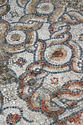 Wall Art - Photograph - Detail of geometric mosaic walk in front of small shops  from an by Steve Estvanik
