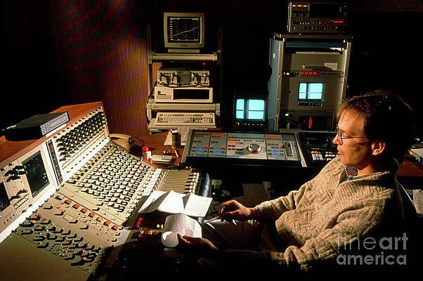 Wall Art - Photograph - Engineer Working In A Sound Recording Studio by Science Photo Library