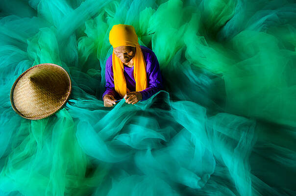 Wall Art - Photograph - Fixing The Net by Rawisyah Aditya
