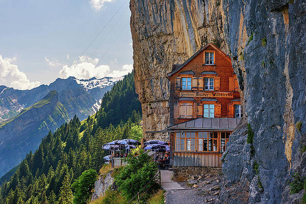Tourism Wall Art featuring the photograph Guest House Aescher-Wildkirchli Under A Cliff On Mountain Ebenalp In Switzerland by Miroslav Liska