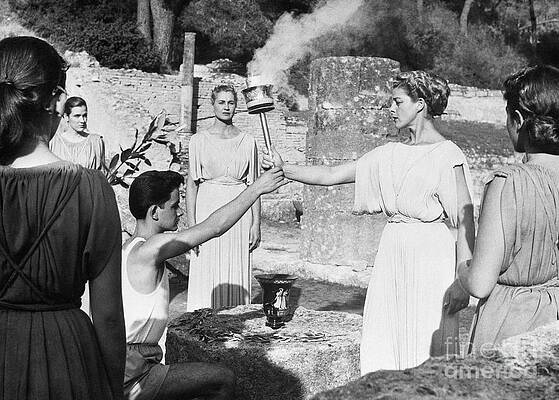 Wall Art - Photograph - Handing Over The Olympic Torch by Bettmann