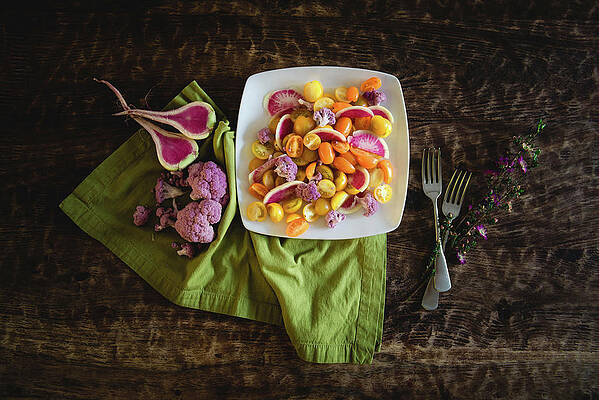 Wall Art - Photograph - High Angle View Of Salad Served In Plate With Flowers And Forks By Napkin On Wooden Table by Cavan Images