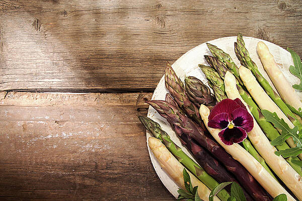 Wall Art - Photograph - High Angle View Of Various Asparagus With Flower In Plate On Wooden Table by Cavan Images