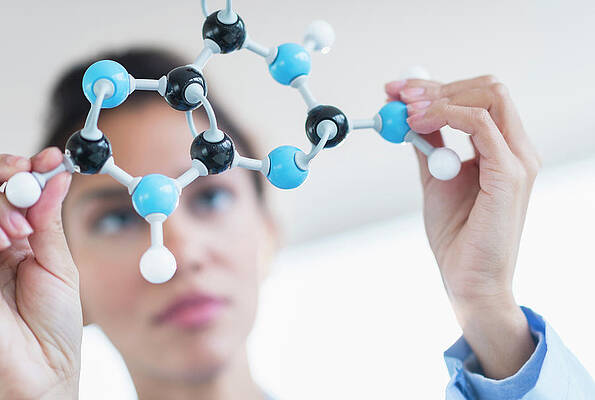 Wall Art - Photograph - Hispanic Scientist Examining Molecular by Jgi/tom Grill