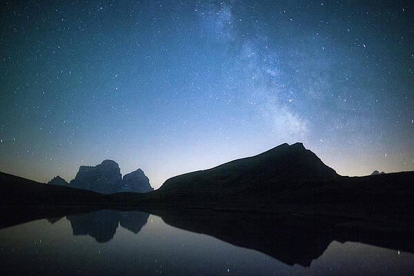 Wall Art - Photograph - Milky Way And Stars On Pelmo Mirrored In Baste Lake, Dolomites, Italy by Cavan Images