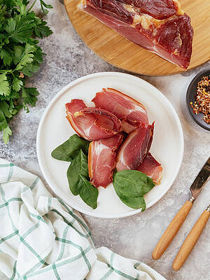 Wall Art - Photograph - Pastrami Sliced On A Plate With Herbs by Cavan Images