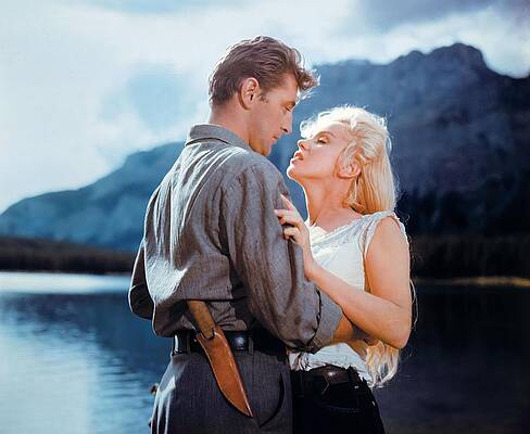 Wall Art - Photograph - ROBERT MITCHUM and MARILYN MONROE in RIVER OF NO RETURN -1954-. by Album