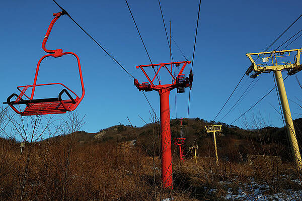 Wall Art - Photograph - Ski Lift Chairs Hang at the Abandoned by Jorge Silva