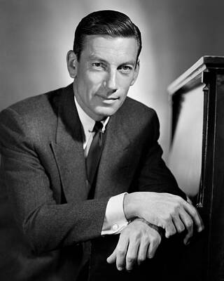 Wall Art - Photograph - Smiling Hoagy Carmichael Sitting With Arms Crossed by Globe Photos